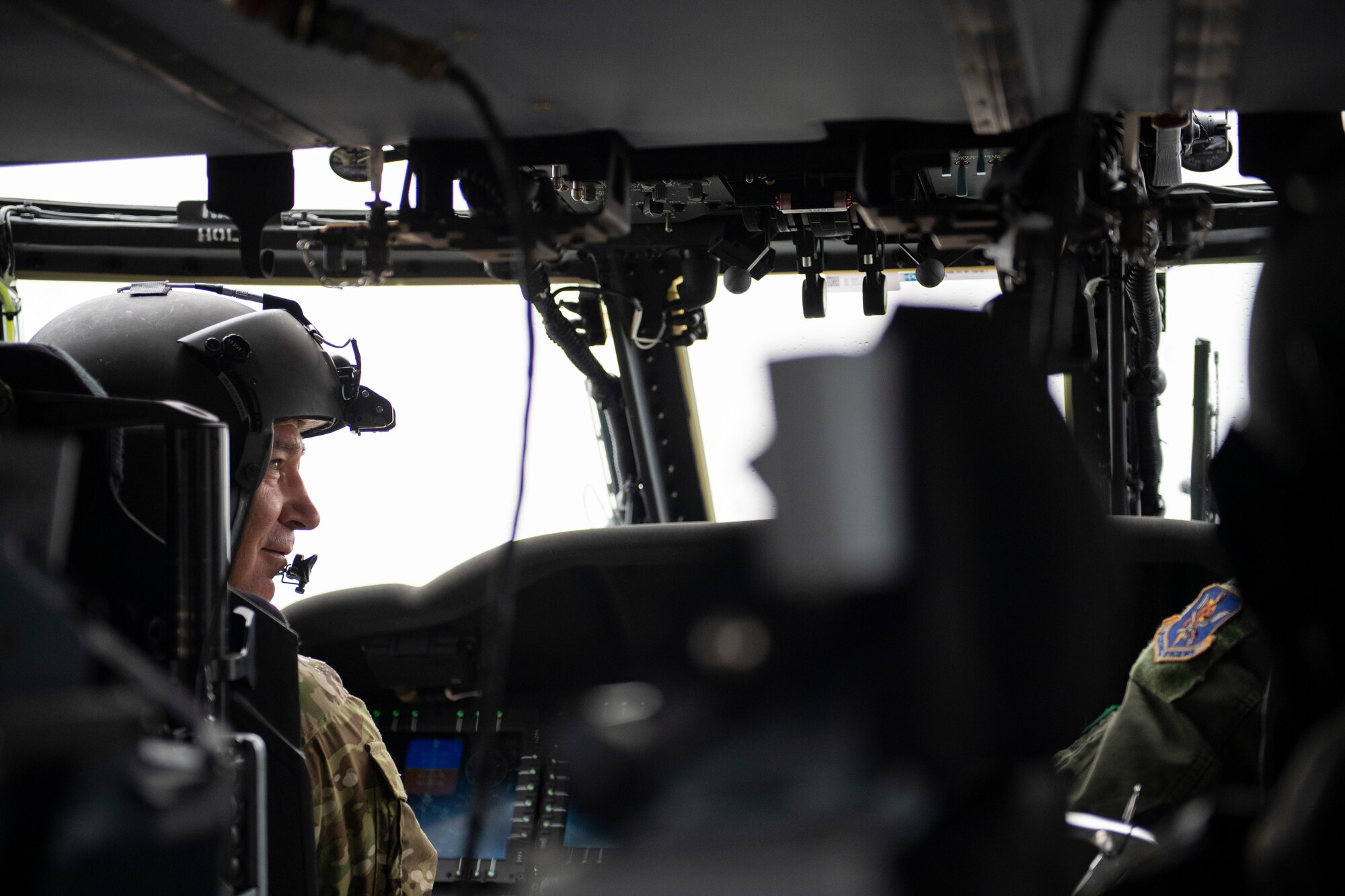 A photo of Major General Franks preparing for takeoff in the new HH-60W Jolly Green II helicopter.
