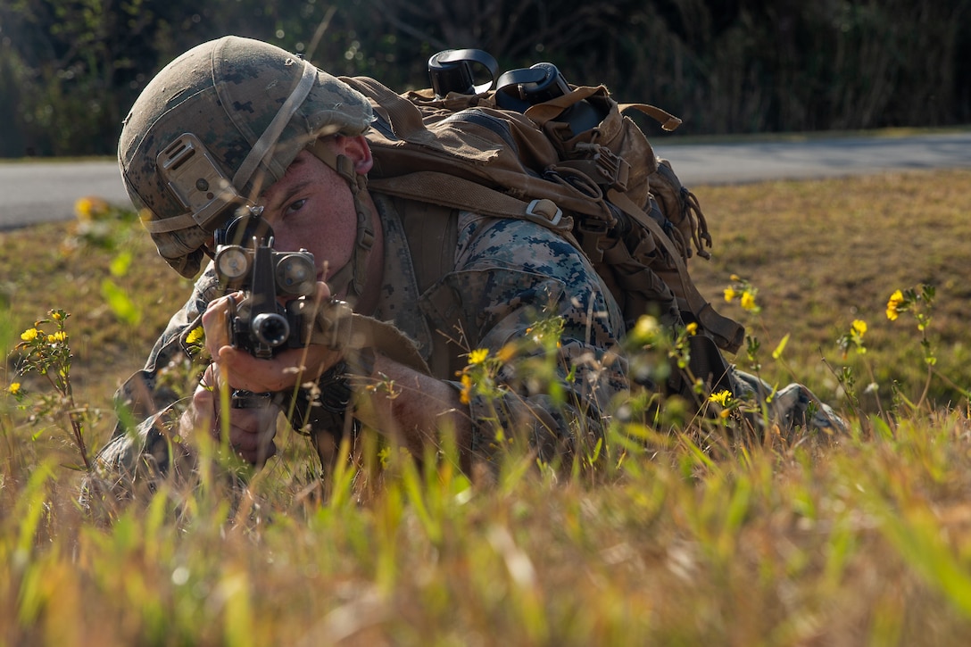 A U.S. Marine takes part in the defensive fundamentals portion of the 3rd Marine Division Rifle Squad Competition at Camp Hansen, Okinawa, Japan, Jan. 14.