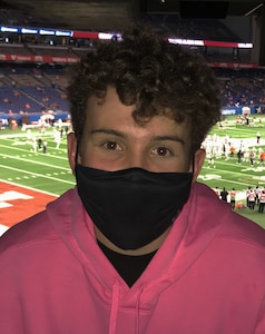 Randolph High School senior Bradley Lundington, 2020 Valero Alamo Bowl scholarship recipient, poses for a photo while attending the Alamo Bowl in San Antonio, Dec. 29, 2020.