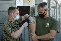 U.S. Marine Corps Maj. Gen. Christopher J. Mahoney, commanding general of 3rd Marine Aircraft Wing, receives the COVID-19 vaccine aboard MCAS Miramar. Vaccines are being administered in a phased approach, prioritizing health care workers and first responders, as well as mission critical and deploying personnel. (U.S. Marine Corps photo Cpl. Leilani Cervantes)