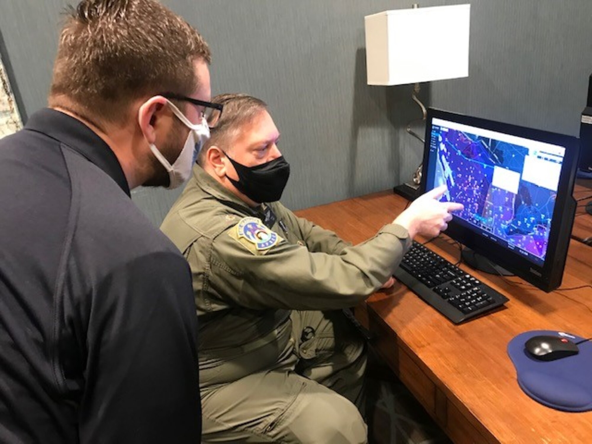 Lt. Col. Robert Bowden, Michigan Wing Civil Air Patrol, and Maj. Rod Rakic, Illinois Wing Civil Air Patrol, fly a mission to distribute COVID vaccine in Michigan while two U.S. Public Health Service officers monitor cooler temperatures in back of the plane. The mission was part of an interagency agreement between the Civil Air Patrol and U.S. Department of Health and Human Services – Indian Health Service. Authorized under the Economy Act, the agreement allowed CAP to act as a Civilian Auxiliary of the Air Force, and fly the vaccine inside a 12-hour period to prevent spoilage.  (Civil Air Patrol photo)