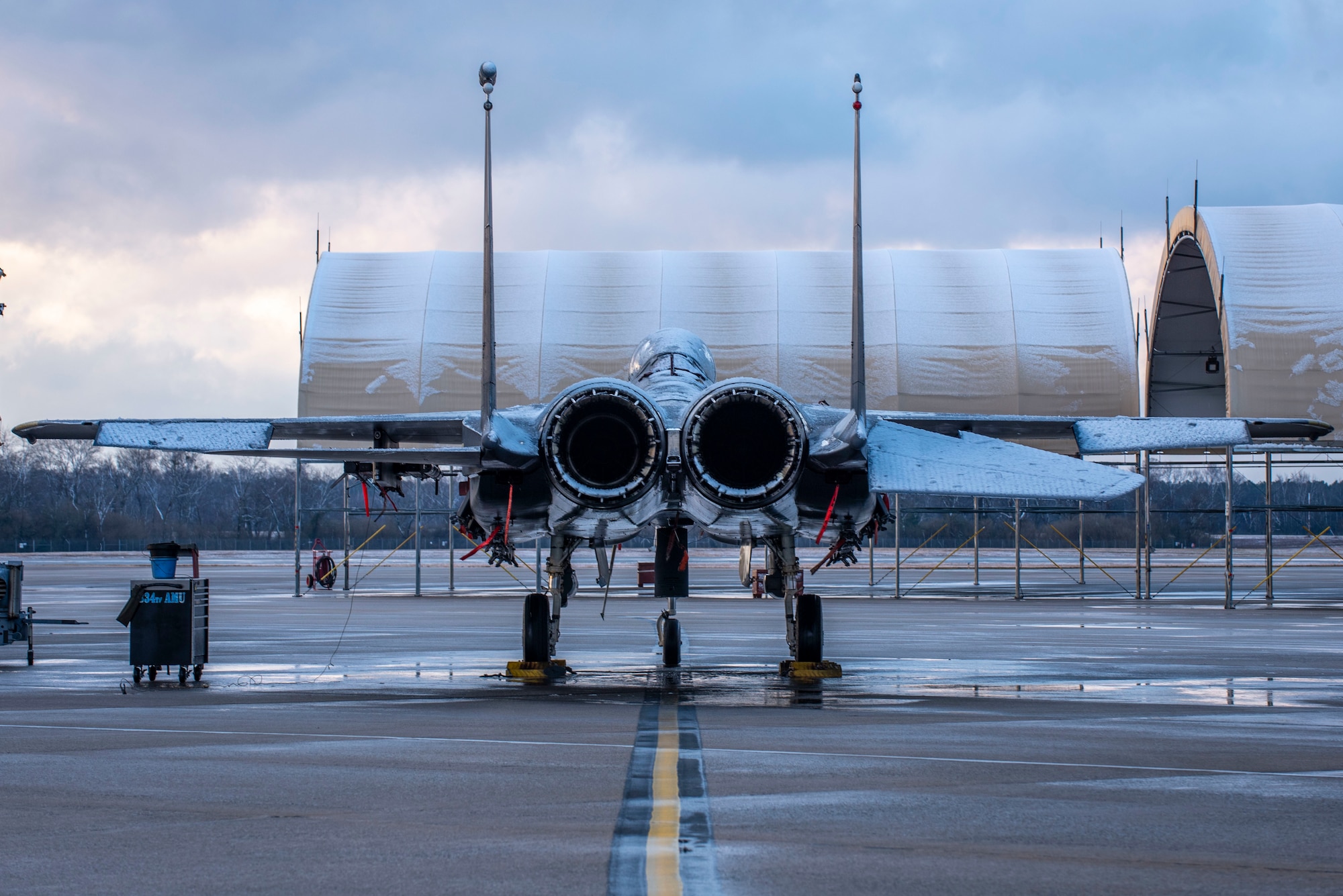 An F-15E Strike Eagle from the 334th Fighter Squadron is covered in snow at Seymour Johnson Air Force Base, North Carolina, Jan. 28, 2021.