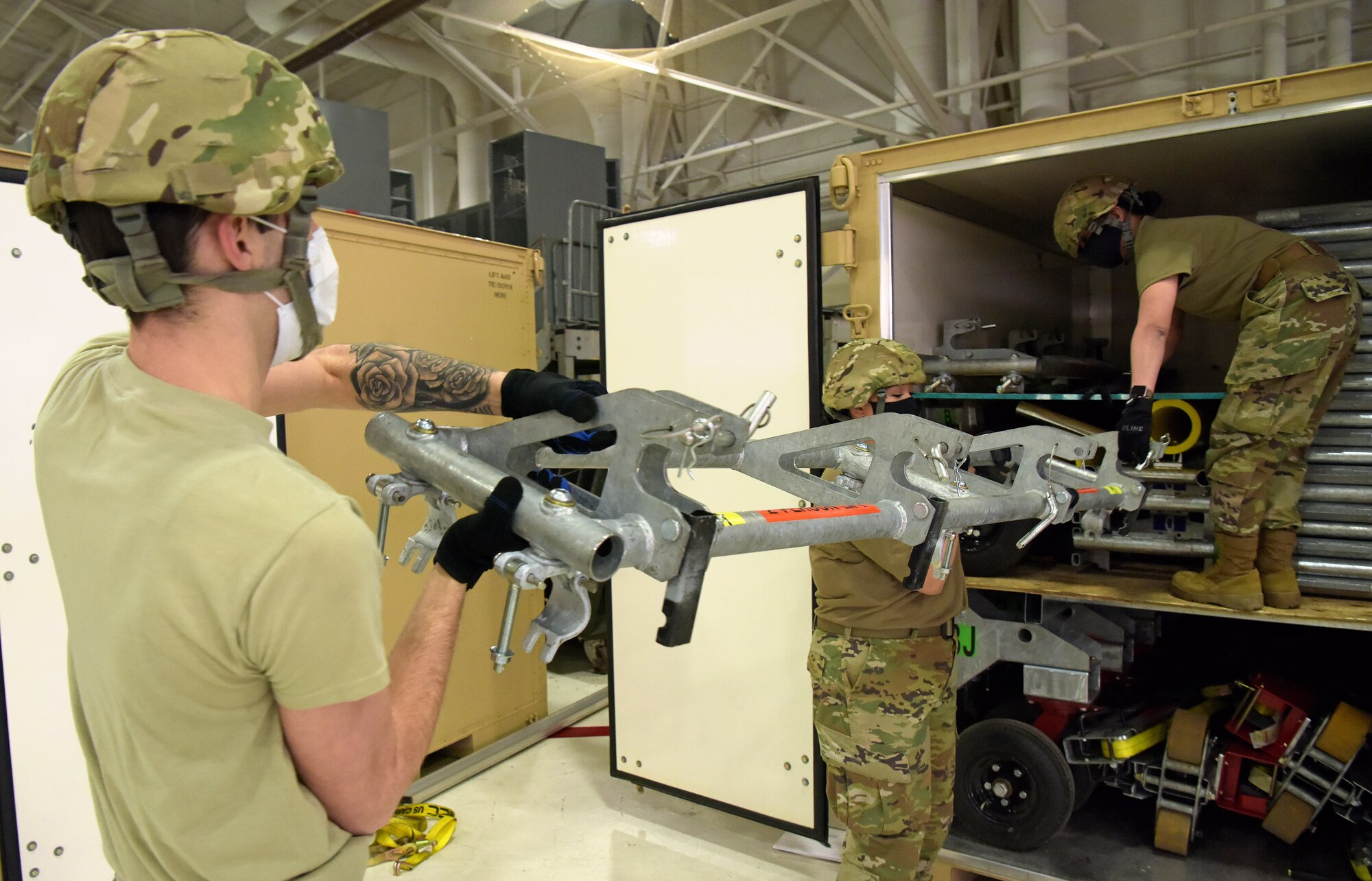 Medical technicians from the 375th Medical Group begin constructing the Patient Loading System at Scott Air Force Base, Illinois, Jan. 26, 2021. The PLS is a portable and constructable ramp used to safely on- and off-load patients to high-deck aircraft, such as the KC-10 Extender, KC-46 Pegasus and KC-135 Stratotanker. (U.S. Air Force photo by Master Sgt. R.J. Biermann)