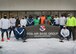 Members of the 66th Comptroller Squadron pose for a photo before participating in a memorial 5K run for a fallen finance colleague at Hanscom Air Force Base, Mass., Jan. 27. Col. James “Rob” Culpepper, director of Financial Management and comptroller for Air Combat Command, Joint Base Langley-Eustice, Virginia, lost his six month battle with Leukemia in December 2020. (U.S. Air Force photo by Todd Maki)