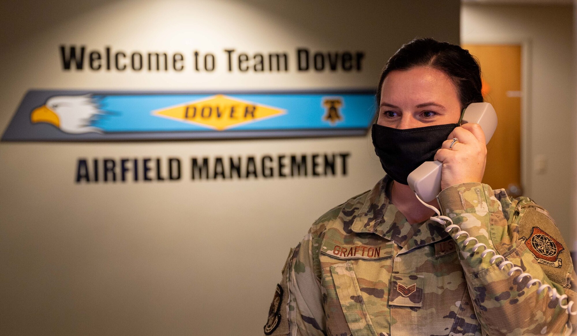 Senior Airman Kristina Grafton, 436th Operation Support Squadron airfield management operations supervisor, tests the base crash phone at Dover Air Force Base, Delaware, Jan. 14, 2021. As an airfield management journeyman, Grafton manages airfield operations, which includes coordinating with civil engineers, safety, air traffic control and various other base agencies to ensure safe aircraft operations within the airfield of Dover AFB. Airfield management is responsible for conducting daily tests of the crash telephone network. (U.S. Air Force photo by Airman 1st Class Faith Schaefer)