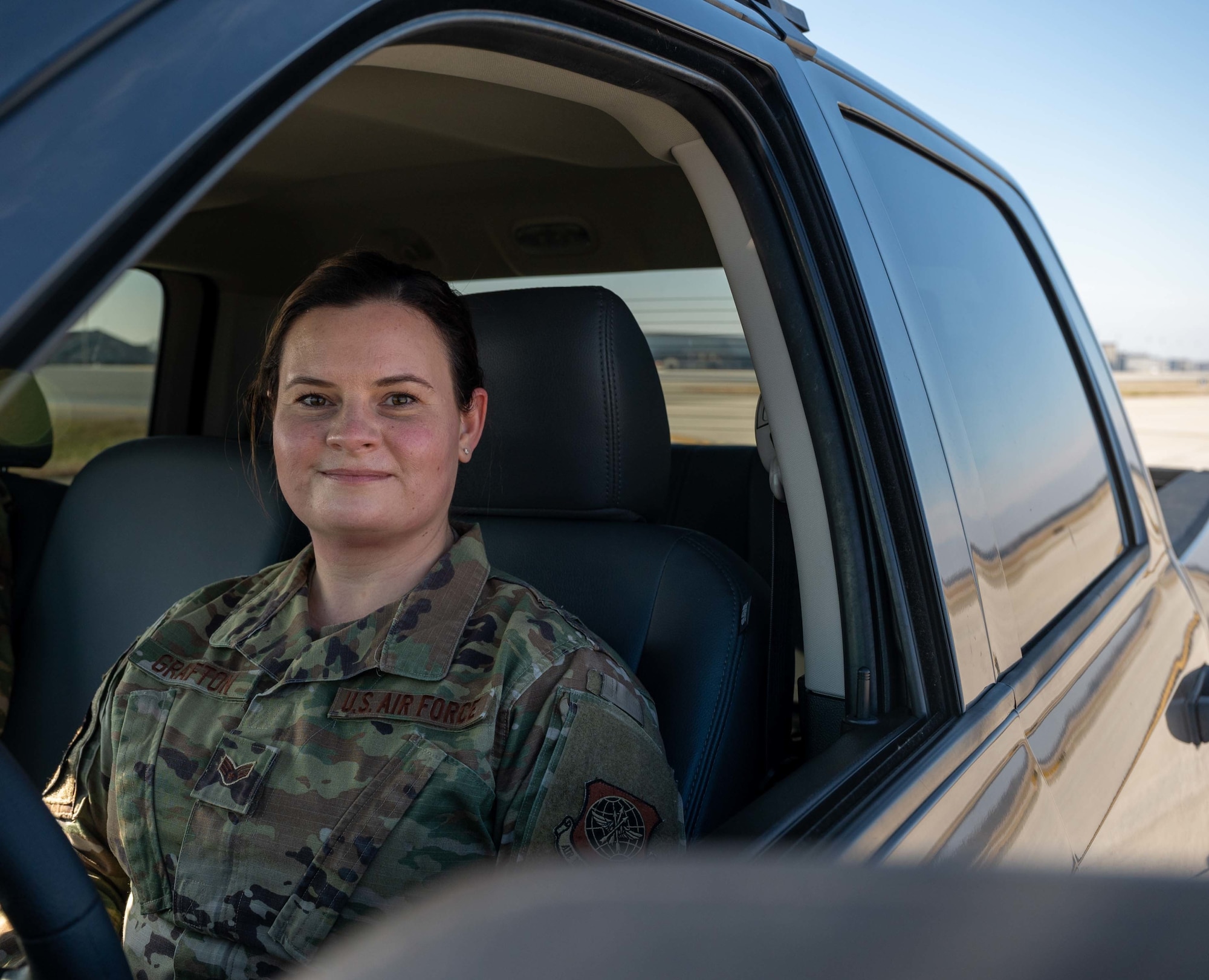 Senior Airman Kristina Grafton, 436th Operations Support Squadron airfield management operations supervisor, poses for a photo on the flight line at Dover Air Force Base, Delaware, Jan. 14, 2021. After the delayed launch of Total Force Training Records, Grafton built a digital training tracker, which was distributed to 133 other bases by the Air Force Flight Standards Agency as the airfield management career field’s interim standard for training documentation. (U.S. Air Force photo by Airman 1st Class Faith Schaefer)