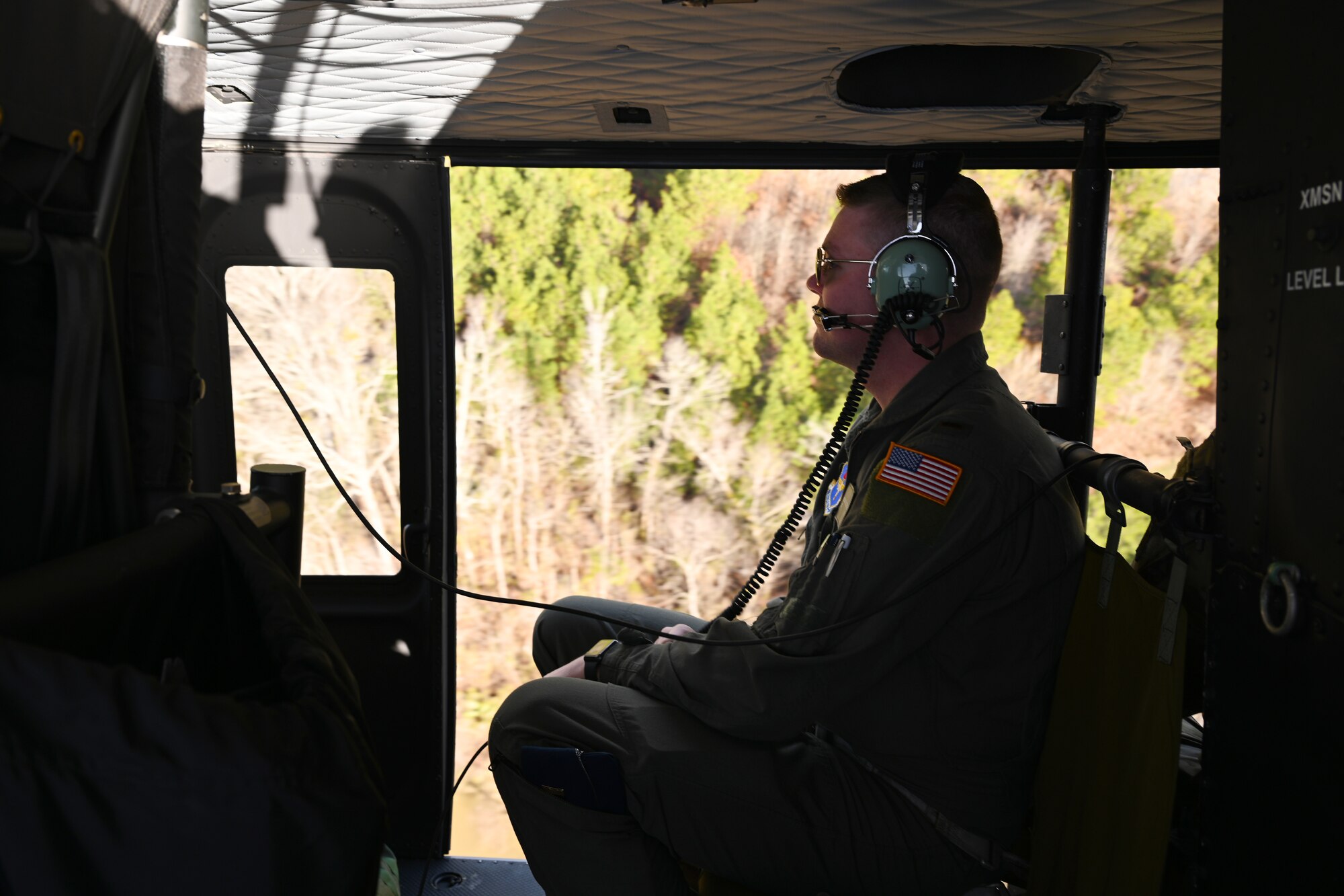 U.S. Air Force 2nd Lt. Kevin Schroeder, 14th Student Squadron student pilot, looks out of a TH-1H Huey during an incentive ride Jan. 26, 2021, on Columbus Air Force Base, Miss. In December, 2004, modification of the existing UH-1H into the TH-1H configuration began. Lockheed Martin produced the first TH-1H in July, 2005, (U.S. Air Force photo by Senior Airman Jake Jacobsen)