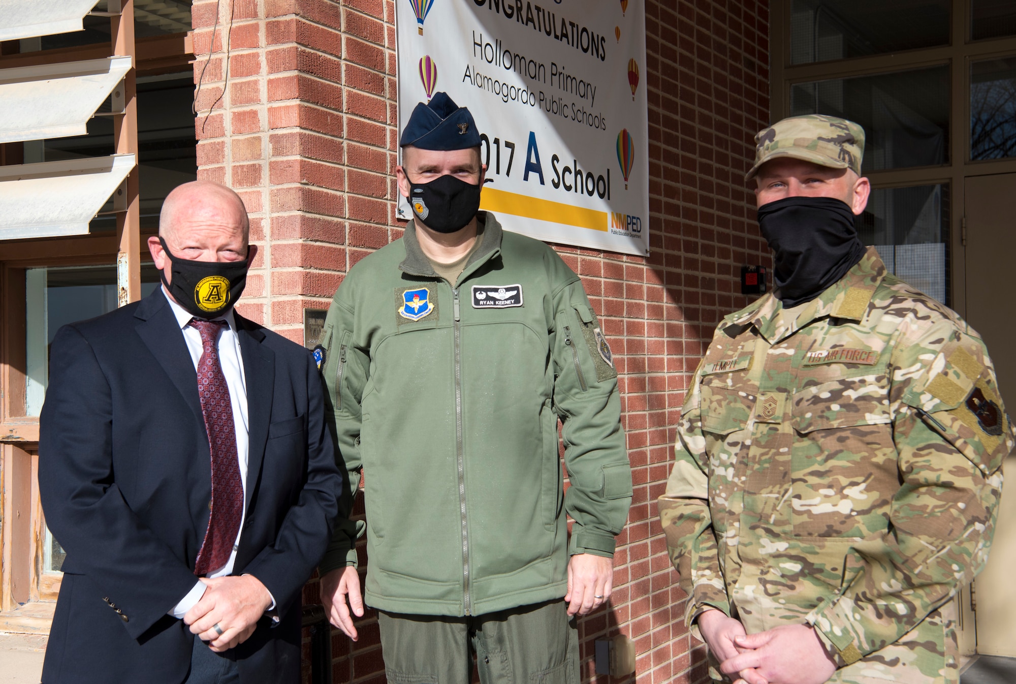 (From left to right) Jerrett Perry, Alamogordo Public School District superintendent, Col. Ryan Keeney, 49th Wing commander and Chief Master Sgt. Thomas Temple, 49th WG command chief, pose for a photo, Jan. 19, 2021, on Holloman Air Force Base, New Mexico. Holloman schools offer programs such as Anchored4Life, Deployed Kids Club and an on-site Military Family Life Counselor to support the unique culture of being a military child. (U.S. Air Force photo by Airman 1st Class Jessica Sanchez)