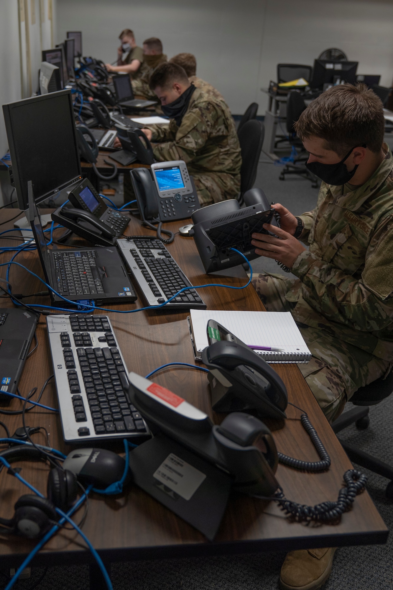 U.S. Air Force Airman Thatcher LaPrise, 338th Training Squadron student, practices connecting a phone to a network in Bryan Hall at Keesler Air Force Base, Mississippi, on Jan. 26, 2021. The 338th TRS has been working towards a modular curriculum, which enables students to receive the training tailored to their future assignment, for approximately five years. (U.S. Air Force photo by Airman 1st Class Kimberly L. Mueller)
