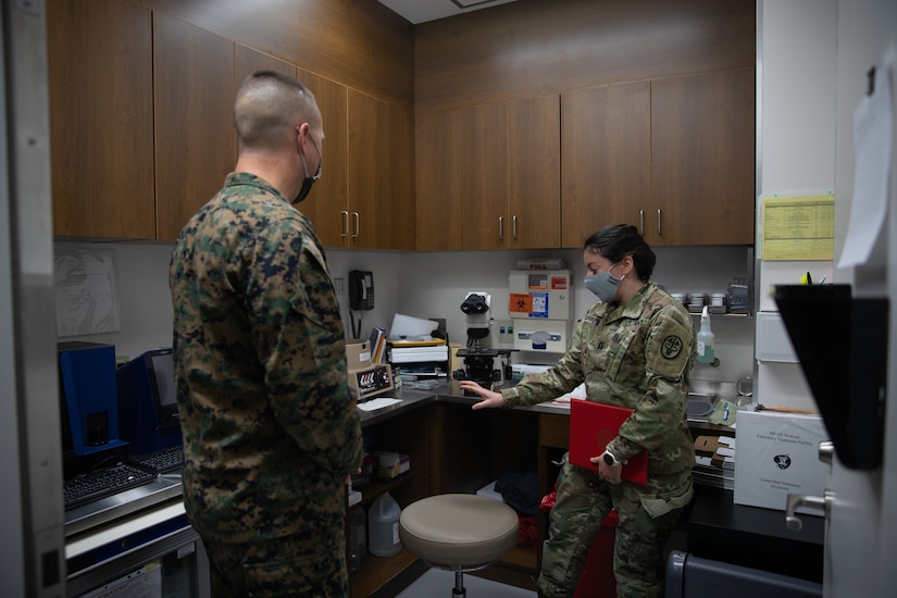 U.S. Army Capt. Austin Sorrels, right, officer-in-charge of the Iwakuni Veterinary Treatment Facility (VTF) gives U.S. Marine Corps Col. Lance Lewis, left, commanding officer of Marine Corps Air Station (MCAS) Iwakuni, a tour of the VTF aboard MCAS Iwakuni, Jan. 7, 2021. (U.S. Marine Corps photo by Lance Cpl. Triton Lai)