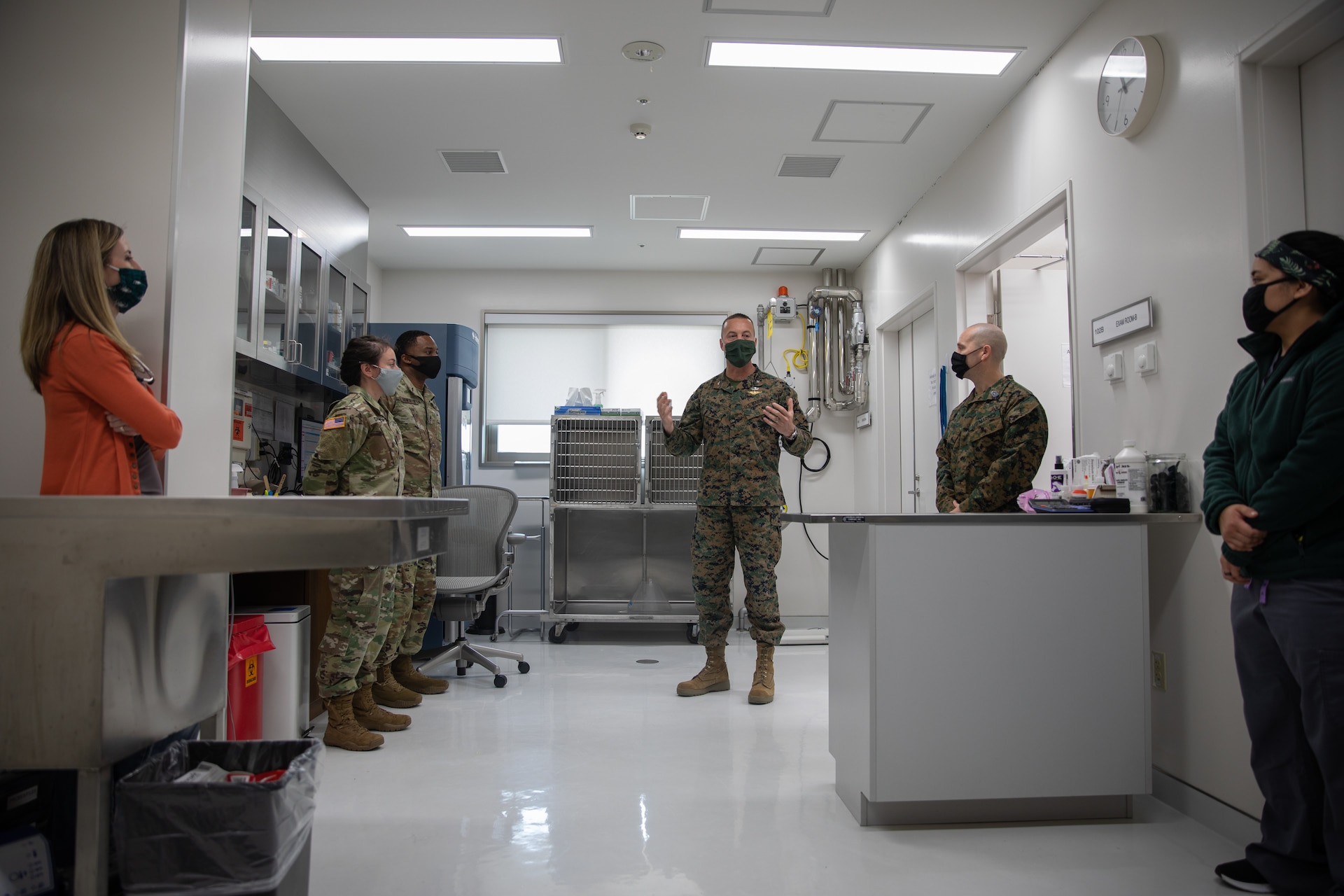 U.S. Marine Corps Col. Lance Lewis, commanding officer of Marine Corps Air Station (MCAS) Iwakuni, speaks with the staff at the Iwakuni Veterinary Treatment Facility (VTF) during an award ceremony aboard MCAS Iwakuni, Jan. 7, 2021. The ceremony was held to present the VTF the Impact Iwakuni award for the impact they have made aboard the air station during the month of December. (U.S. Marine Corps photo by Lance Cpl. Triton Lai)