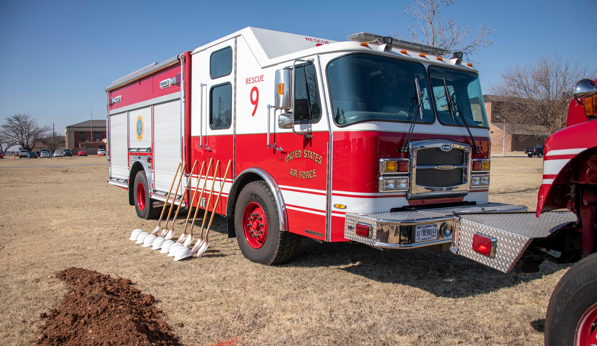 An Altus Air Force Base (AFB) firetruck sits on display at the Fire Rescue Center ground breaking ceremony at Altus AFB, Oklahoma, Jan. 26, 2021. Once the center is complete, it will have five pass-through vehicle bays to support 10 firefighting vehicles. (U.S. Air Force photo by Airman 1st Class Amanda Lovelace)