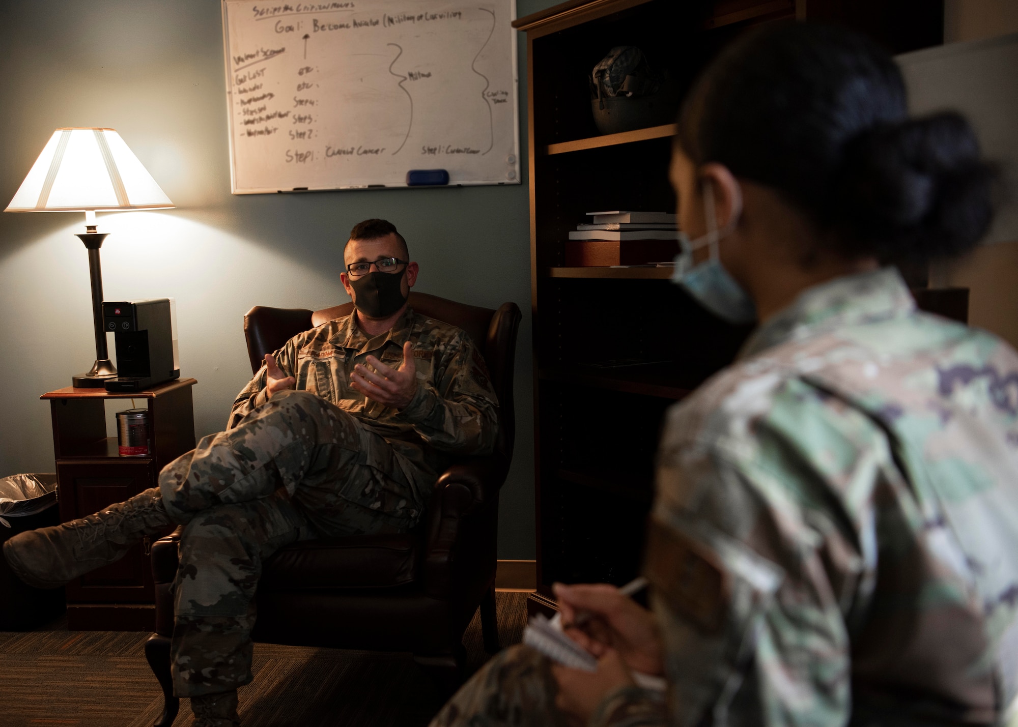 Capt. Kevin Malina, 36th Medical Operations Squadron mental health provider, speaks with an Airman during a session in his office at Andersen Air Force Base, Guam, Jan. 28, 2021. Over the past 56 years, the Biomedical Science Corps has undergone changes, adapted, and innovated to provide the best care possible for the Airmen they service. (U.S. Air Force photo by Senior Airman Aubree Owens)