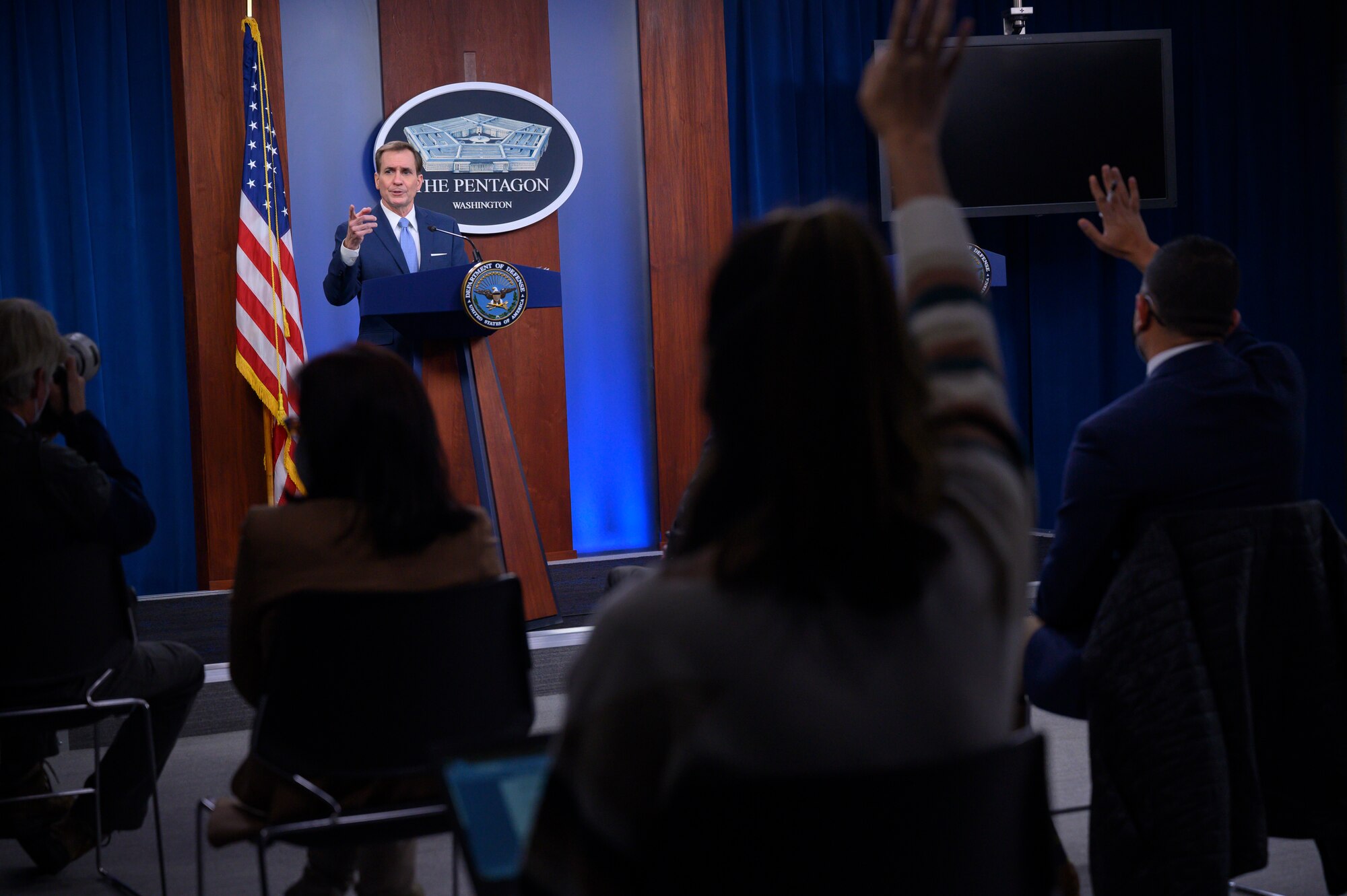 A man stands at a podium and speaks.