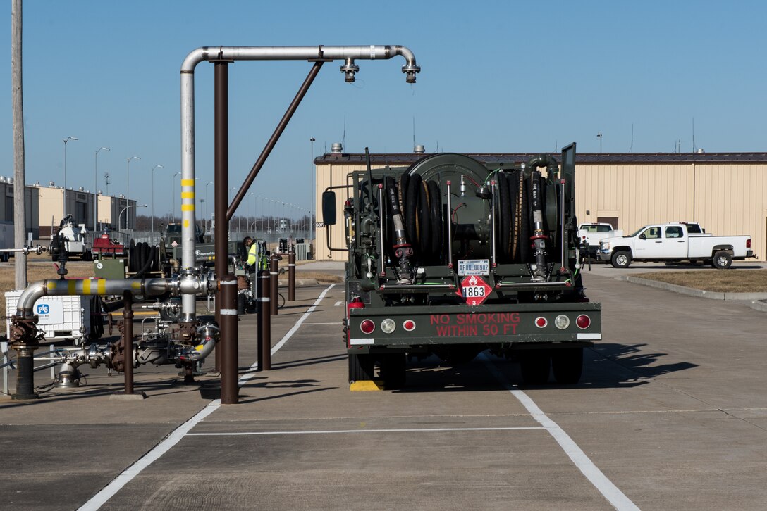 An R-11 fuels truck sits at a fuels truck fill stand at Whiteman Air Force Base, Missouri, Jan. 12, 2021.  The Fiscal Year 2024 Defense Logistics Agency Military Construction project will enable R-11 fuels trucks to refuel closer to the Petroleum, Oil and Lubricants compound and will enable them to fill other T-38 Talon and A-10 Thunderbolt II aircraft without traversing through the restricted area to fill their tanks. (U.S. Air Force photo by Airman 1st Class Christina Carter)