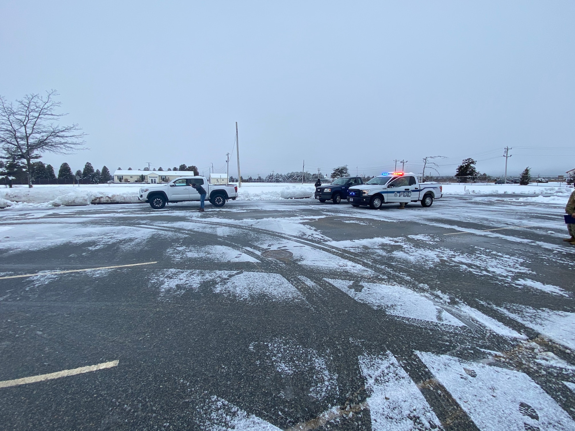 Photo of the "perpetrator", 102 IW Director of Inspections, Mr. Scott Etler, was hand-cuffed and both he and his vehicle were searched by Patrolman Staff Sgt. Erik Madden. Providing backup was Entry Controller Mr. Christopher Hankins.