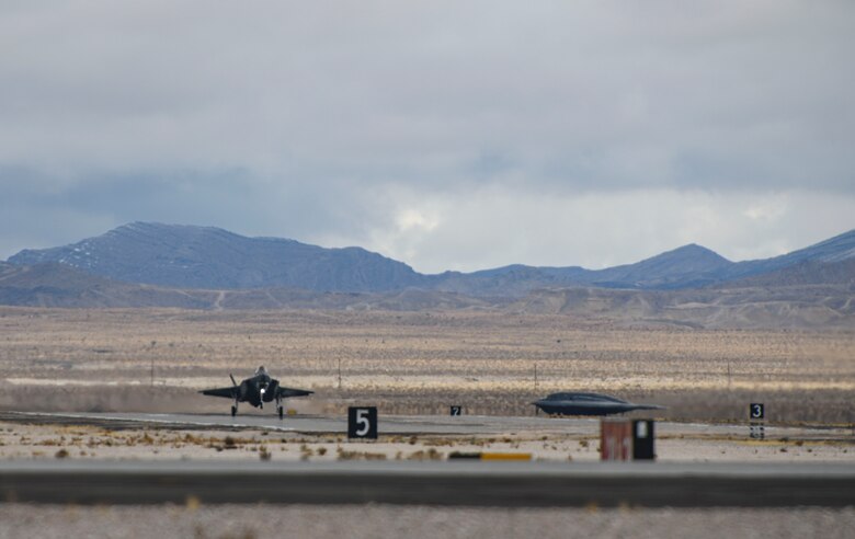 An F-35 Lightning II lands at Nellis Air Force Base, Nevada, Jan. 26, 2021. During Red Flag 21-1, the 393rd Expeditionary Bomb Squadron flew B-2 Spirit Stealth Bomber training mission with multiple aircraft in order to further enhance their experience for future sorties. (U.S. Air Force photo by Staff Sgt. Sadie Colbert)