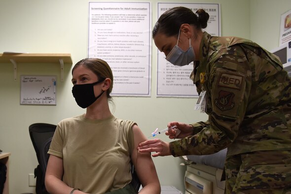 U.S. Air Force Maj. Heather Foster, 8th Medical Group public health emergency officer, receives the second dose of the Moderna COVID-19 vaccine at Kunsan Air Base, Republic of Korea, Jan. 26, 2021. Foster was the first recipient on Kunsan to receive the vaccine in December. (U.S. Air Force photo by Senior Airman Suzie Plotnikov)