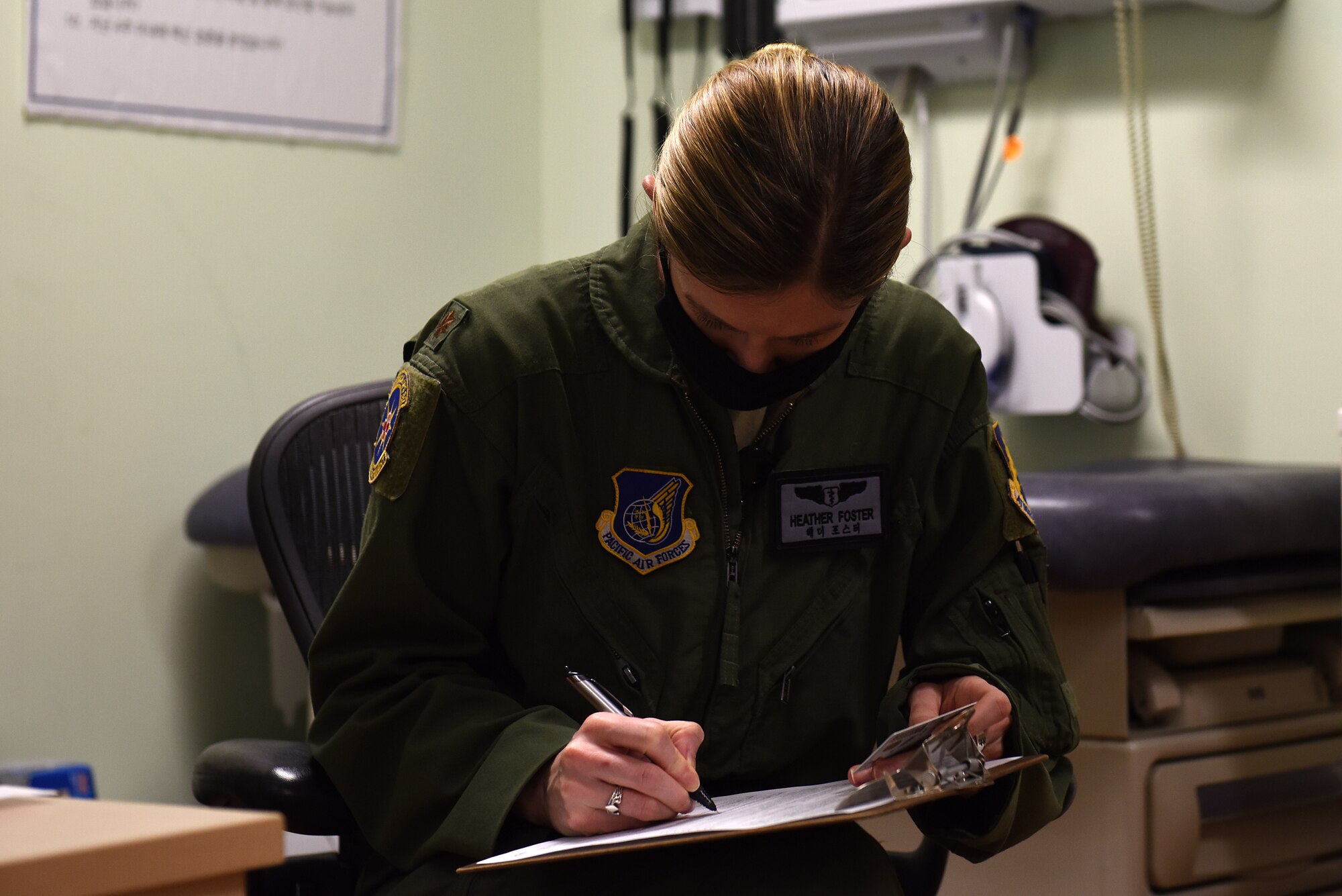 U.S. Air Force Maj. Heather Foster, 8th Medical Group public health emergency officer, fills out paperwork prior to receiving the second dose of the Moderna COVID-19 vaccine at Kunsan Air Base, Republic of Korea, Jan. 26, 2021. Foster was the first recipient on Kunsan to receive the vaccine in December. (U.S. Air Force photo by Senior Airman Suzie Plotnikov)