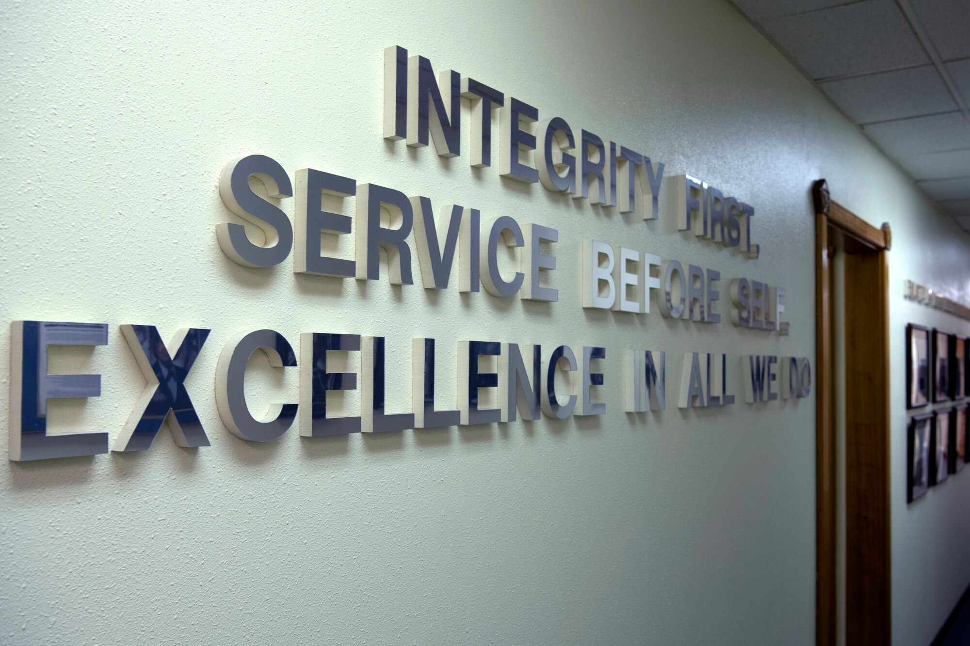 The Air Force core values hang at the McDaniel Center at Kadena Air Base, Japan, Jan. 8, 2021. The McDaniel Center hosted an open house to honor the service of the first American enlisted Airman, Cpl. Edward Ward, and the first American enlisted aviator, Cpl. Vernon Lee Burge. (U.S. Air Force photo by Airman 1st Class Stephen Pulter)
