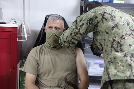 U.S. Army Col. Scott Desormeaux, brigade commander of the Louisiana National Guard’s 256th Infantry Brigade Combat Team, receives the COVID-19 vaccine at Erbil Air Base, Iraq, Jan.18, 2021. Combined Joint Task Force-Operation Inherent Resolve (CJTF-OIR) received 300 vaccines for the Combined Joint Operations Area, 110 of those were administered at EAB.