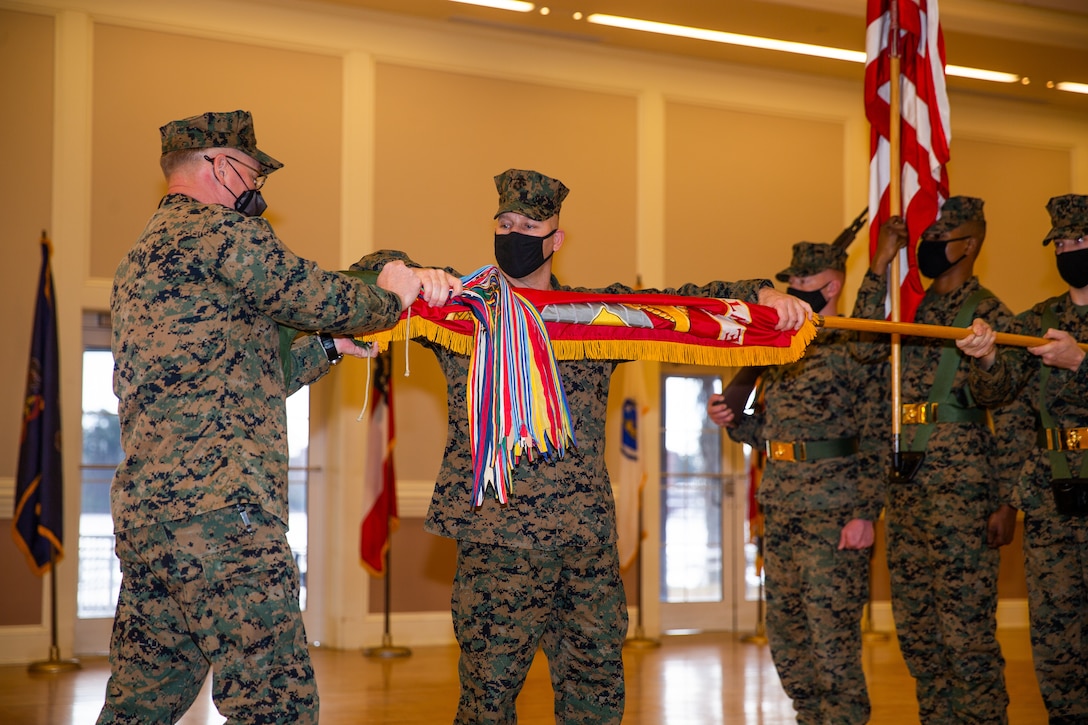 U.S. Marines case the regimental colors during a deactivation ceremony on Camp Lejeune, N.C., Jan. 28.