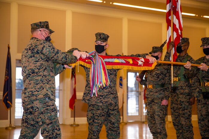 U.S. Marines case the regimental colors during a deactivation ceremony on Camp Lejeune, N.C., Jan. 28.