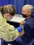 Rear Admiral Anthony "Jack' Vogt, commander of District 13, receives the COVID-19 vaccine at Base Seattle on Monday, Jan. 11, 2021. Hundreds of Coast Guardsmen throughout the Pacific Northwest elected to receive the vaccine as of Jan. 15. (U.S. Coast Guard photo by Petty Officer 2nd Class Steven Strohmaier)