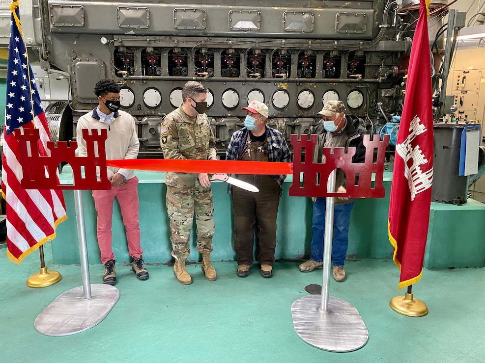 IN THE PHOTO, Memphis District Commander Col. Zachary Miller, District Partners, and other district leadership were briefed on the details of the St. Francis bridge (CR736) project at the exact site where the construction took place. Afterward, the group held a ribbon-cutting ceremony (in the photo), symbolizing the victory and celebration of completing yet another significant project. (USACE photo by Jessica Haas)