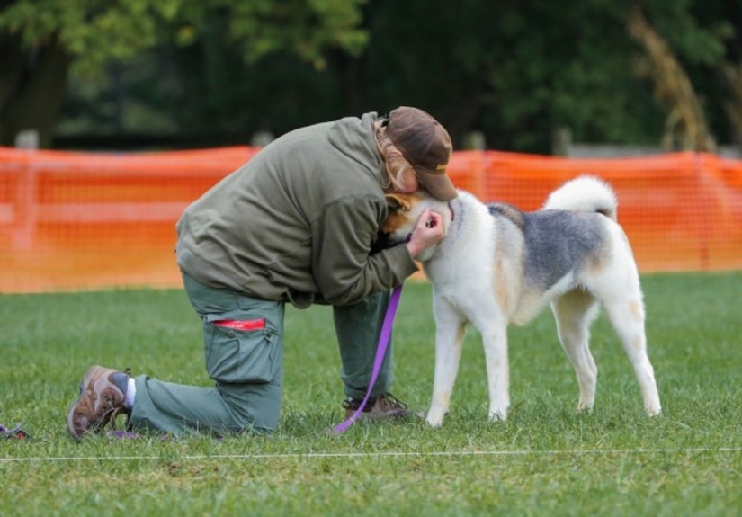 Photo of Kimberly Appel embracing Kitara after a competition event.