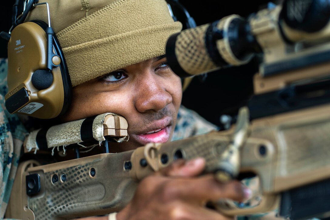 A Marine fires a weapon.