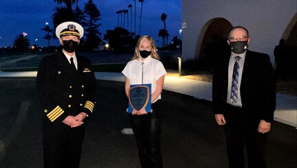 Capt. David T. Hart, commander, Southwest Regional Maintenance Center, and Stan Crabtree, detachment director,
Puget Sound Naval Shipyard & Intermediate Maintenance Facility Detachment San Diego, present Sierra Vickers, a pipefitter with Shop 99P, Temporary Services, at Puget Sound Naval Shipyard & Intermediate Maintenance Facility, with the 2021 Scholastic Achievement Award. She earned a cumulative 4.0 GPA. The Southwest Regional Apprentice Program graduated 11 apprentices during an outdoor, drive-through commencement ceremony Jan. 28, 2021, in San Diego.