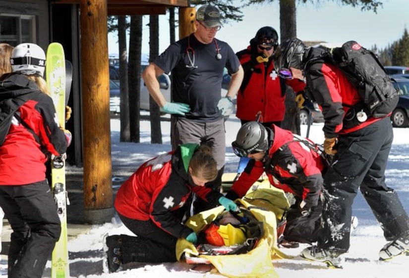 A skier receives medical care