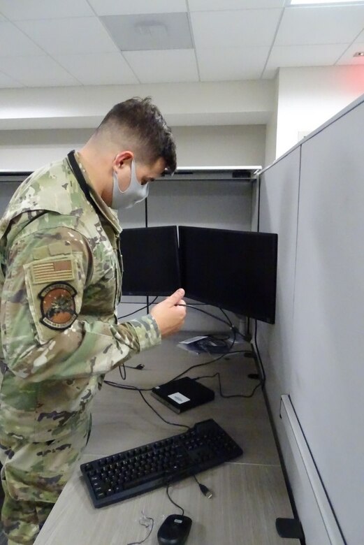 Photo of personnel moving equipment