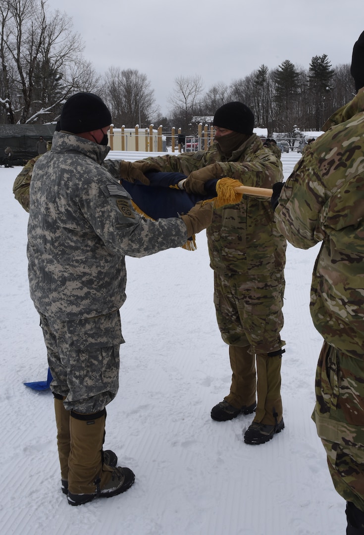 Col. Brey Hopkins (left) and Lt. Col. Matthew Wignall case the colors of the 3rd Battalion, 172nd Infantry during a sendoff ceremony at the Camp Ethan Allen Training Site parade field Jan. 29, 2021, in Jericho, Vermont. The 3-172nd, part of the Vermont National Guard's 86th Infantry Brigade Combat Team (Mountain), will operate as Task Force Avalanche during a year-long deployment to the U.S. Central Command area of responsibility. (U.S. Army National Guard photo by Don Branum)