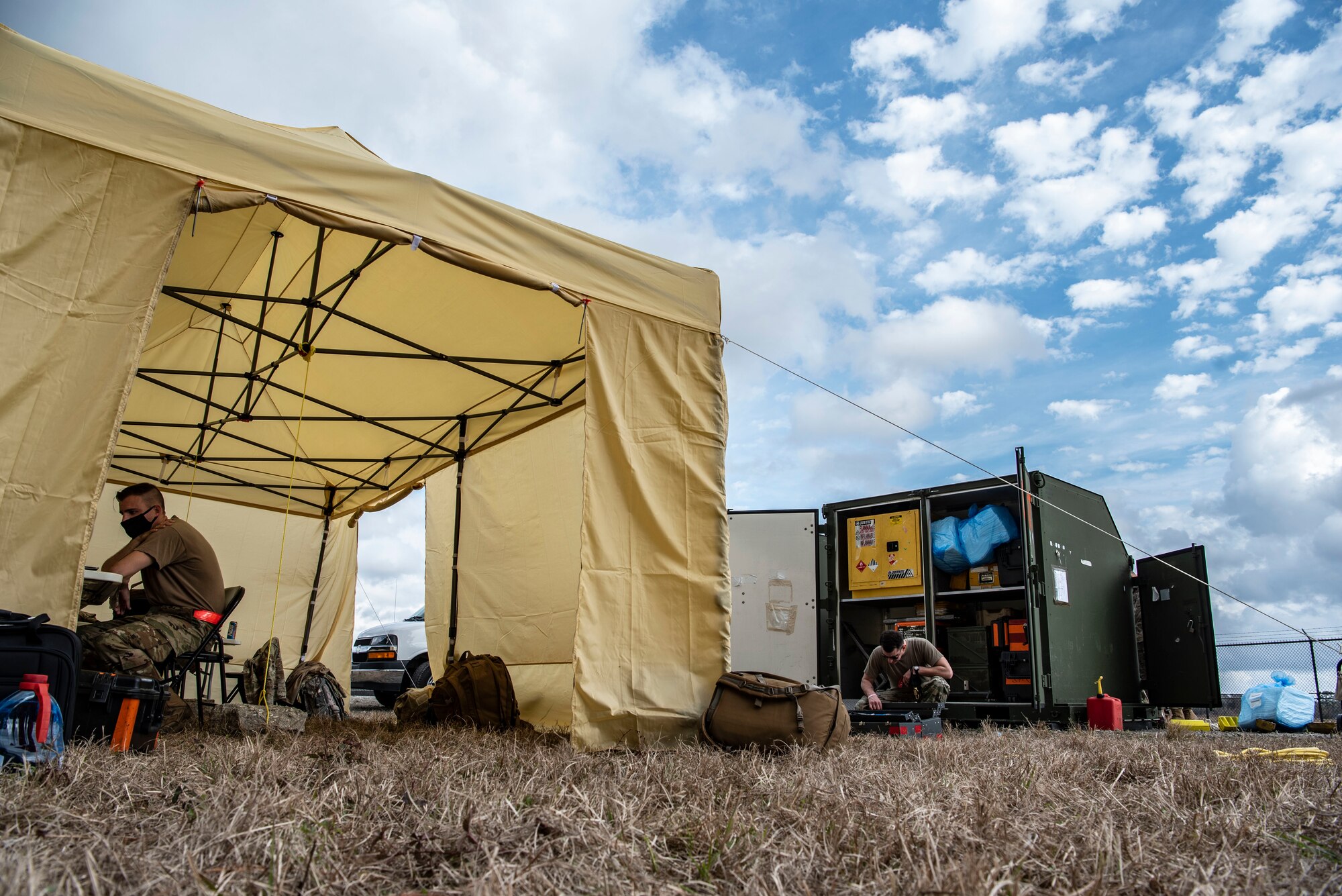 Image of Airmen preparing their work spaces during an exercise.