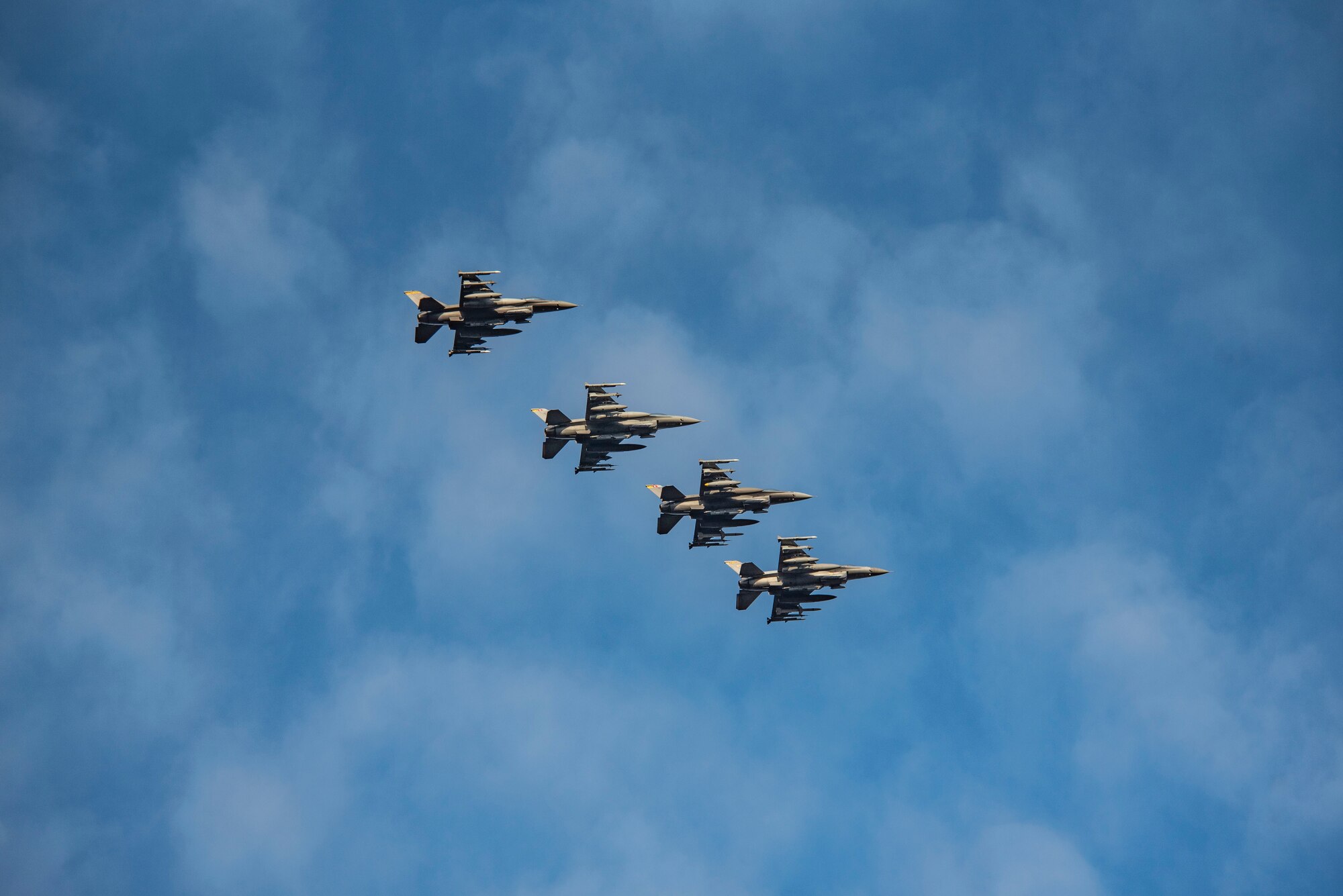 Image of four F-16 Vipers flying through the air.