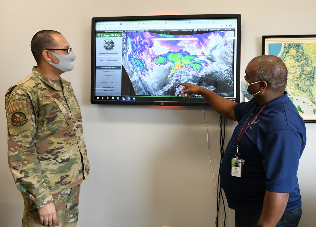 Two men looking at monitor