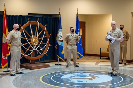 Adm. Christopher W. Grady, commander, U.S. Fleet Forces Command presides over the pinning of Chief Intelligence Specialist Joshua Waldrop and Chief Aviation Aerographer’s Mate Travis Strait during a chief petty officer (CPO) pinning ceremony at the USFFC headquarters in Norfolk, Virginia.