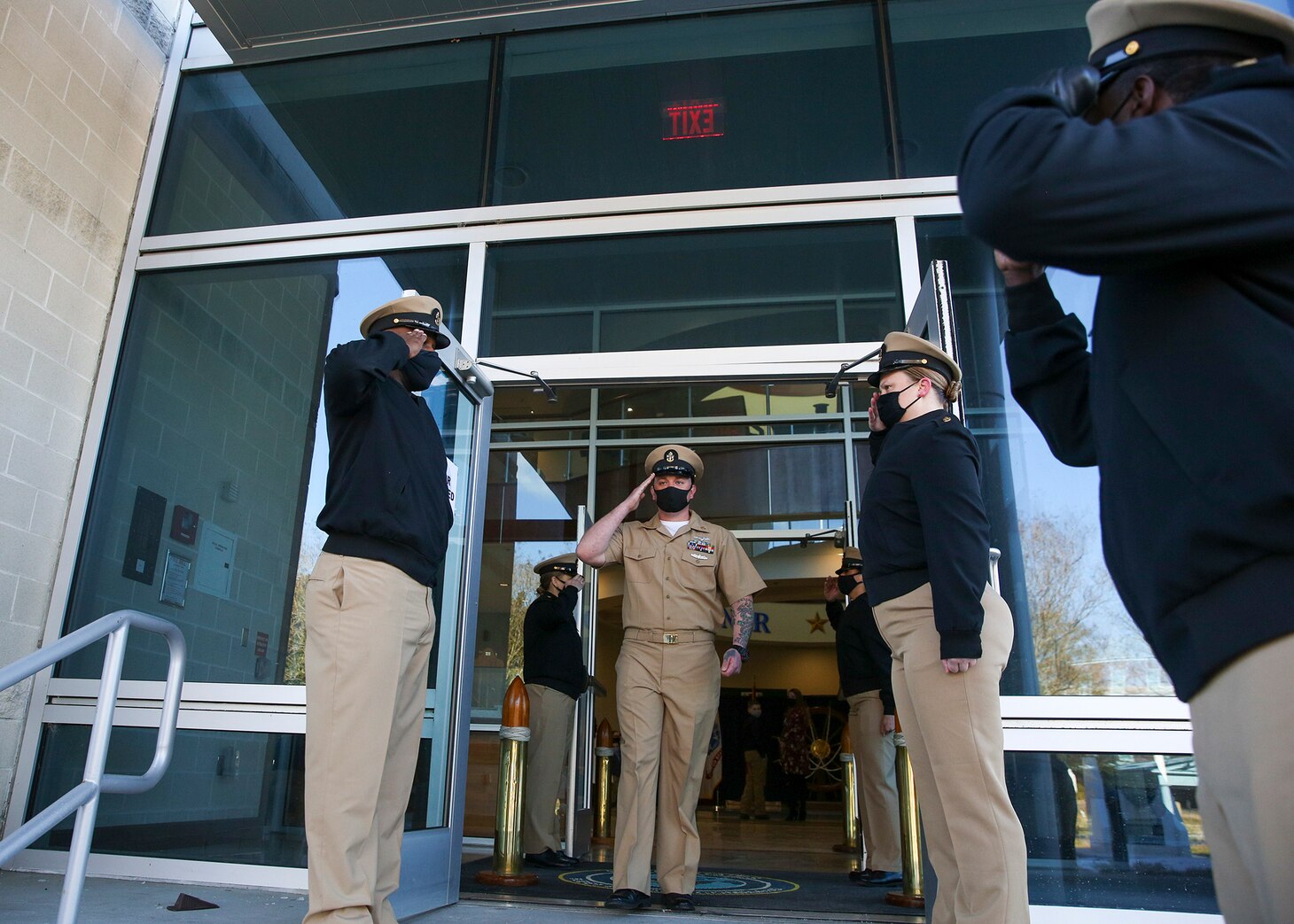Chief Intelligence Specialist Joshua Waldrop, assigned to U.S. Fleet Forces Command (USFFC), renders a hand salute after his advancement during a chief petty officer (CPO) pinning ceremony at the USFFC headquarters in Norfolk, Virginia.