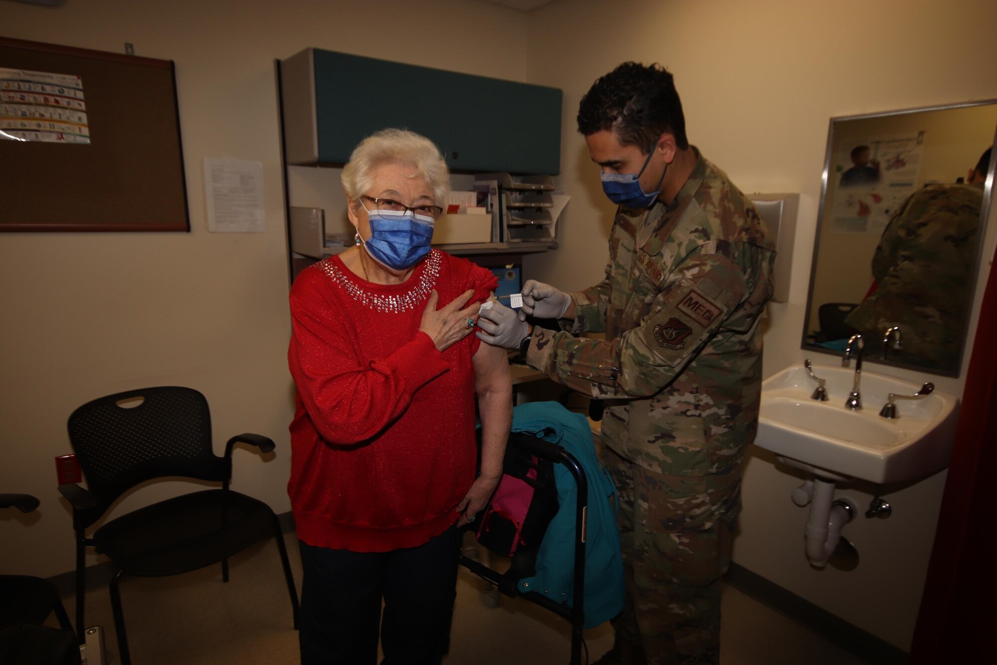 U.S. Air Force Tech. Sgt. Orlando Navarro II, the 673d Healthcare Operations Squadron Allergy and Immunizations Clinic noncommissioned officer in charge, administers the first of a two-dose series of a COVID-19 vaccine to Patricia James, a TRICARE beneficiary, at Joint Base Elmendorf-Richardson, Alaska, Jan. 29, 2021. JBER is inoculating personnel following the Department of Defense’s prioritization guidelines. The vaccines are part of Operation Warp Speed, a national initiative to accelerate the development, production and distribution of safe and effective COVID-19 vaccines, therapeutics and diagnostics.