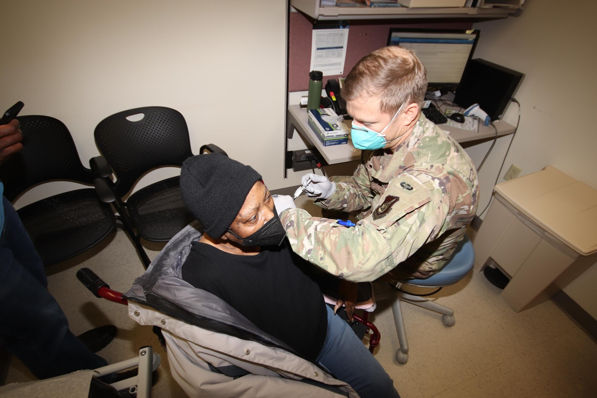 U.S. Air Force Maj Nicholas M. Nelson, a 673d Healthcare Operations Squadron Emergency Department clinical nurse specialist, administers the first of a two-dose series of a COVID-19 vaccine to a TRICARE beneficiary at Joint Base Elmendorf-Richardson, Alaska, Jan. 29, 2021. JBER is inoculating personnel following the Department of Defense’s prioritization guidelines. The vaccines are part of Operation Warp Speed, a national initiative to accelerate the development, production and distribution of safe and effective COVID-19 vaccines, therapeutics and diagnostics.