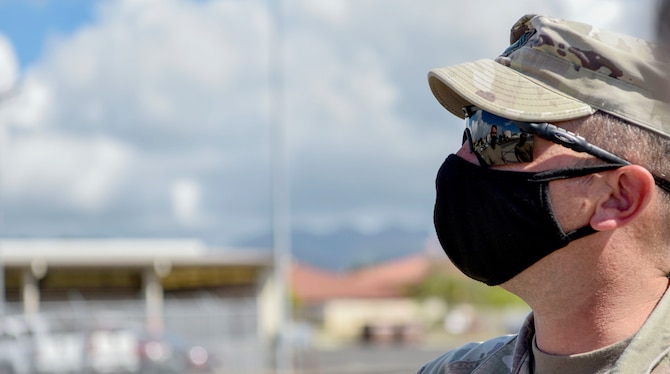 A U.S. Army Soldier from the 25th Infantry Division , talks with 735th Air Mobility Squadron supervisors during a joint inspection of Army equipment in support of Operation Bull Wings, an Emergency Deployment Readiness Exercise at Joint Base Pearl Harbor-Hickam, Jan. 21, 2021. The EDRE is a no-notice, rapid-deployment exercise designed to test a unit's ability to alert, marshal, and deploy forces and equipment to an emergency disaster or for contingency operations. (U.S. Air Force photo by Tech. Sgt. Anthony Nelson Jr.)