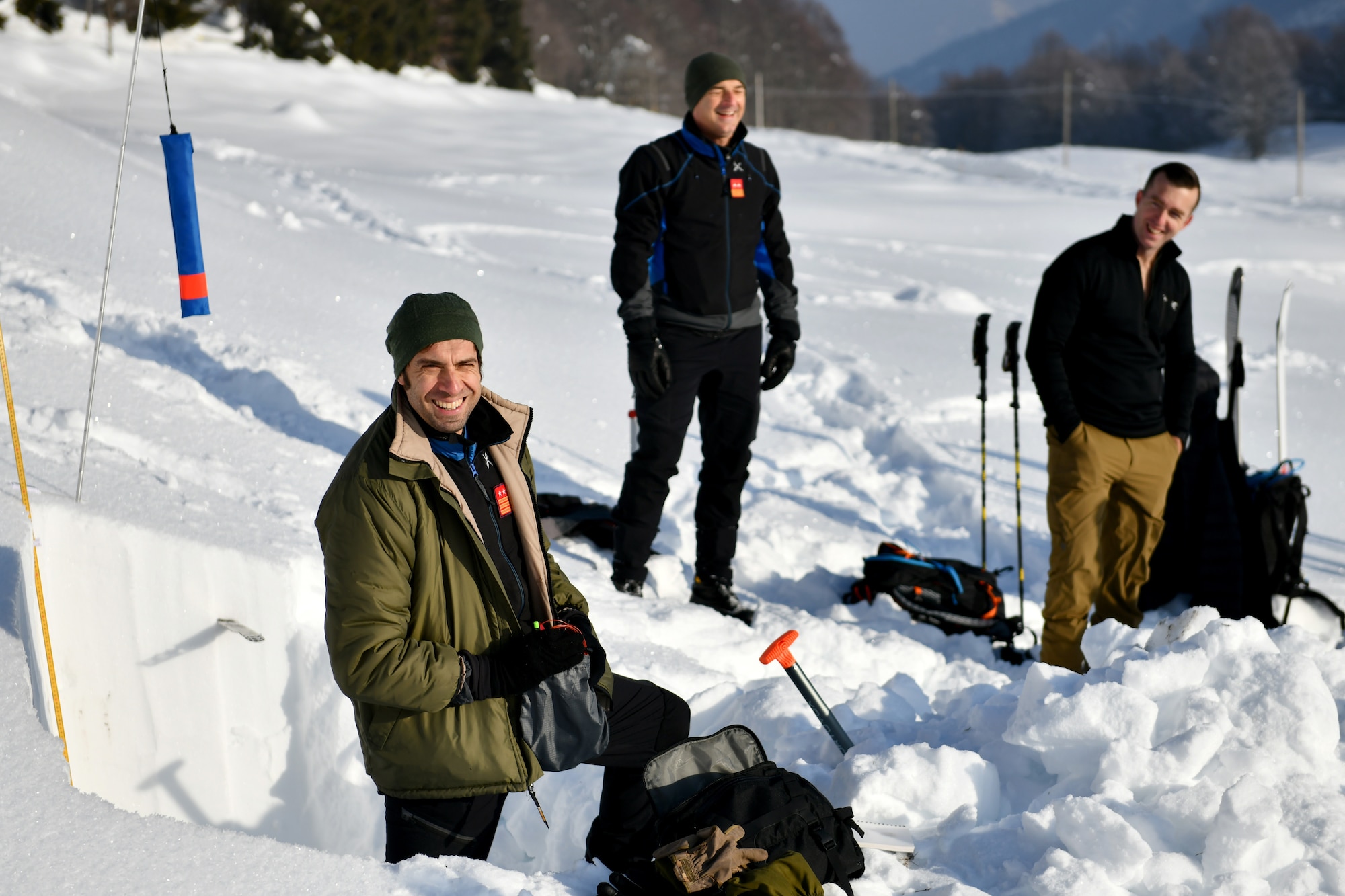 Italian air force Primo Luogotenente Stefano B., left, 15th Wing, 81st Search and Rescue Training Center instructor, speaks to U.S. Airmen assigned to the 31st Fighter Wing at Aviano Air Base, Italy, during an avalanche theory class at Piancavallo, Italy, Jan. 20, 2021. The class covered topics such as snow composition, building snow shelters, and indicators for avalanches. (U.S. Air Force photo by Staff Sgt. K. Tucker Owen)