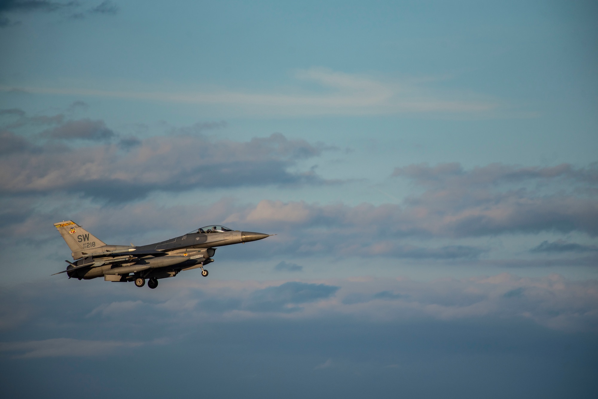 Image of an F-16 Viper flying through the air.