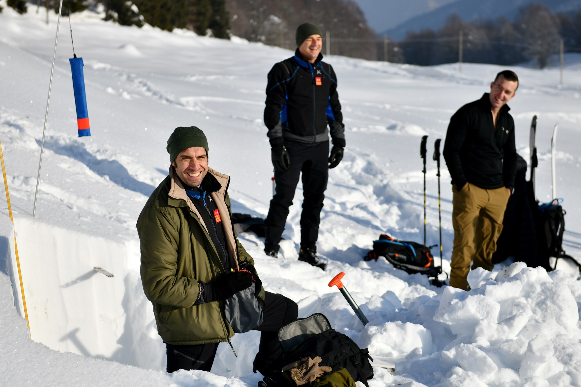 Italian air force Primo Luogotenente Stefano B., left, 15th Wing, 81st Search and Rescue Training Center instructor, speaks to U.S. Airmen assigned to the 31st Fighter Wing at Aviano Air Base, Italy, during an avalanche theory class at Piancavallo, Italy, Jan. 20, 2021. The class covered topics such as snow composition, building snow shelters, and indicators for avalanches. (U.S. Air Force photo by Staff Sgt. K. Tucker Owen)