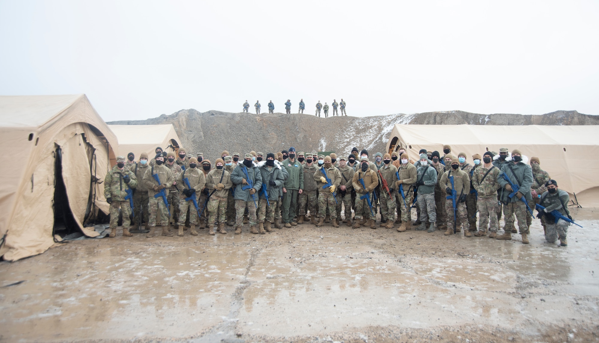 A large group of Airmen pose for a group photo.