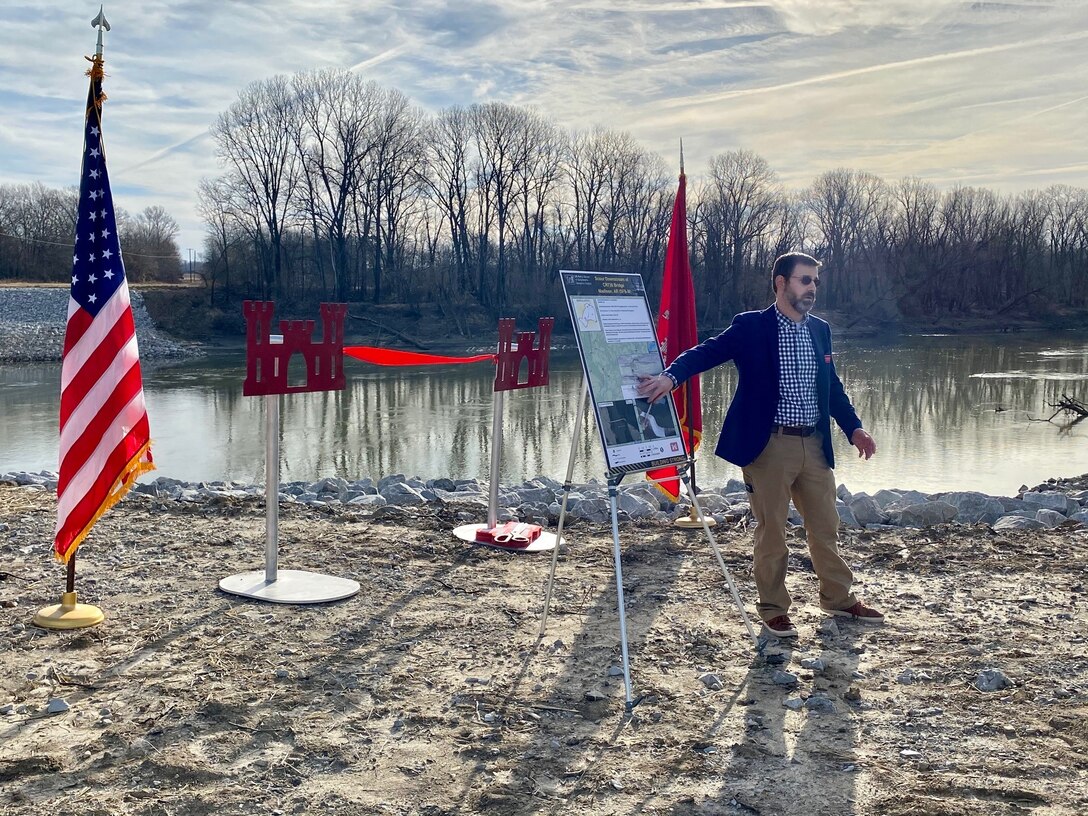 IN THE PHOTO, Memphis District Commander Col. Zachary Miller and other district leadership are briefed on the details of the St. Francis bridge (CR736) project at the exact site where the construction took place. Afterward, the group held a ribbon-cutting ceremony, symbolizing the victory and celebration of completing yet another significant project. (USACE photo by Jessica Haas)