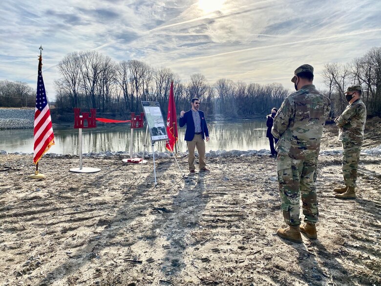 IN THE PHOTO, Memphis District Commander Col. Zachary Miller and other district leadership are briefed on the details of the St. Francis bridge (CR736) project at the exact site where the construction took place. Afterward, the group held a ribbon-cutting ceremony, symbolizing the victory and celebration of completing yet another significant project. (USACE photo by Jessica Haas)