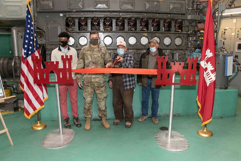 IN THE PHOTO, Memphis District Commander Col. Zachary Miller, District Partners, and other district leadership were briefed on the details of the St. Francis bridge (CR736) project at the exact site where the construction took place. Afterward, the group held a ribbon-cutting ceremony (in the photo), symbolizing the victory and celebration of completing yet another significant project. (USACE photo by Vance Harris)